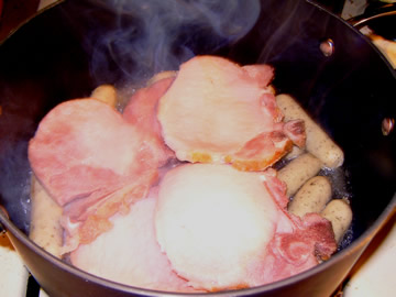 Cooking smoked pork chops (kassler rippchen) and nurnberger brats for our Schlactplatte